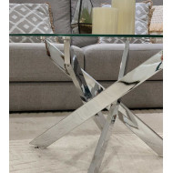 Mesa centro de cristal redonda DAN con patas cruzadas